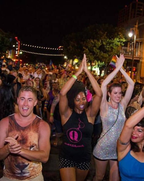 QWELL community members celebrating together at a Pride event