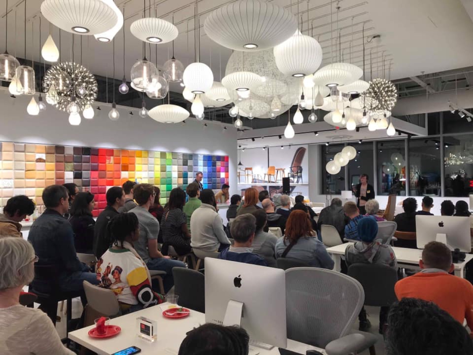 Austin community members in conversation at a QWELL gathering